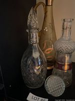 Three carafes grouped together showing shapes and stoppers