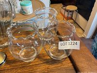three identical glass vases front angle