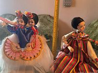 Twin fan-dancer doll beside seated striped hanbok doll, tape measure for scale