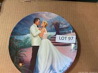 Front view of decorator plate showing artwork and signature