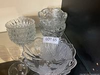Assorted clear glass bowls on shelf