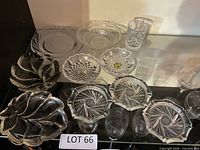 Overview of glass serving bowls, crystal coasters, plates and tumbler