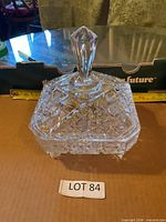 Covered crystal bowl showing full form and feet