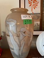 Front view showing calla lily motif and overall shape