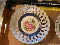 Top view blue-band footed bowl showing pierced rim and central scene