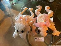 Both Ribbit Ranch plush frogs on table