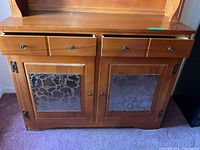 Front view lower section showing two drawers and two glass-pane doors