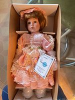 Doll in original box with bubble wrap around legs