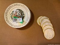 Plate and five coasters laid out on cardboard