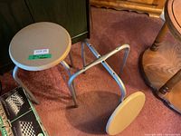 Both stools, one standing, one with detached seat