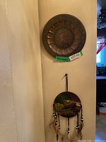 Both wall art pieces hanging together for scale and context