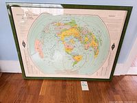 Entire framed map leaning against wall