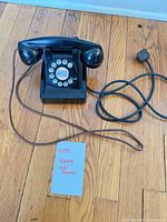 Overall view of telephone, handset, and cord with 4-pin plug