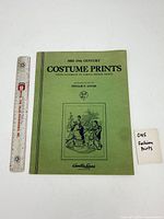 Front cover of folio with ruler for scale