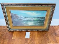 Full view of framed seascape painting