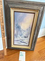 Full framed painting with ruler showing overall size and subject matter