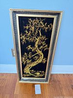 Full view of framed velvet tree landscape painting
