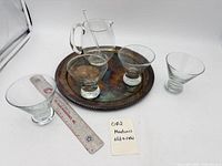 All items: four martini glasses, glass pitcher with stirrer, silver-plated tray