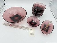 Full set showing large bowl, stack of eight small bowls, handled insert, ruler for scale