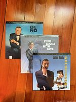 Front jackets of all three LaserDiscs