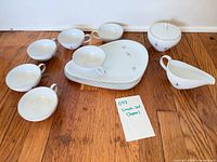 Full set showing cups, plates, creamer and covered sugar bowl