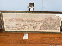 Full view of framed panoramic print on floor