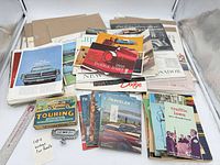 Overall lot showing magazines, brochures, pamphlet, Touring game