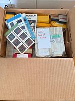 Box containing assorted slides, Kodak boxes and display cards