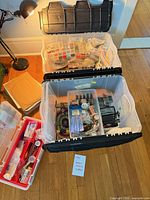 Overview of storage bin, organizers, tool case and contents