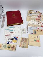 Album, loose stamps, envelopes, postal cards overview