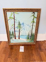 Full view of framed oil landscape painting