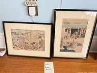 Both framed ukiyo-e prints side by side