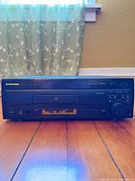 Front view of Pioneer CLD-D704 LaserDisc/CD player powered on