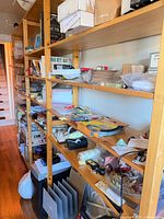 Long view of pine shelving along hallway wall