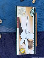 Sealed retail box showing Hunter logo, model 21576, The Shelton, 52-inch ceiling fan