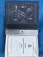 Manual open showing title page with publication details and date