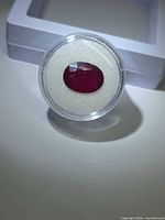 Front view of oval ruby in case