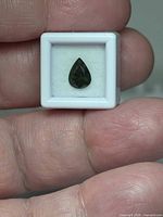 Gemstone in display case, full view