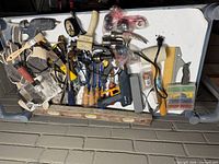 Overall view of tools spread on white surface