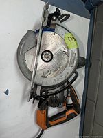 Left side view showing full saw, blade, handle and cord