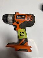 Left side profile of Ridgid R86007 drill showing model and exterior