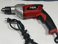 Left side view of Skil corded hammer drill showing body, power cord, keyed chuck