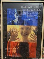 Full view of framed poster showing design and framing.