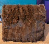 Front view of brown fur hand muff