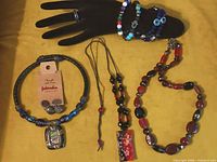 All jewelry pieces displayed together on yellow background