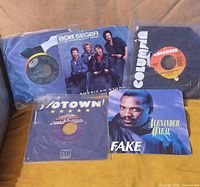 All five singles showing various sleeves and labels