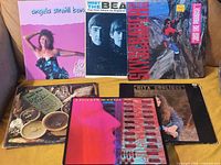 Group shot of all six LPs, fronts visible
