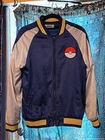 Full front view of Pokémon satin bomber jacket showing color scheme, chest patch and overall condition