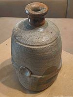Full view of stoneware vase showing glaze colors and shape