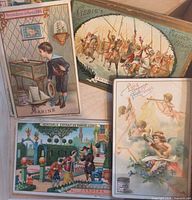 Fronts of four Liebig trade cards showing naval boy, camel cavalry, palace garden, cherubs